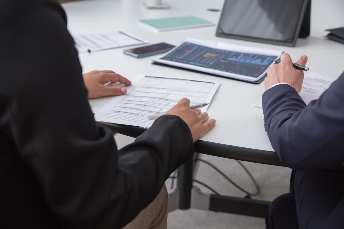 Buyer and supplier reviewing an order